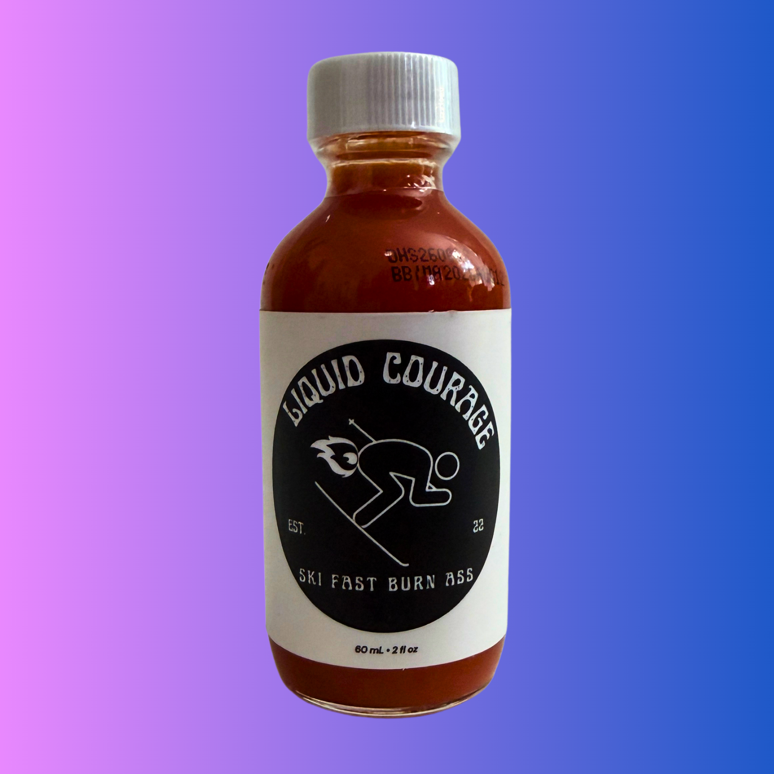 Rise & Alpine Hot Sauce, Ski Fast Burn Ass Tropical Ski Sauce. Front View of bottle. Tropical Flavour. 
